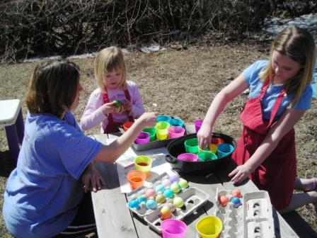My girlies dyeing eggs this year OUTDOORS!