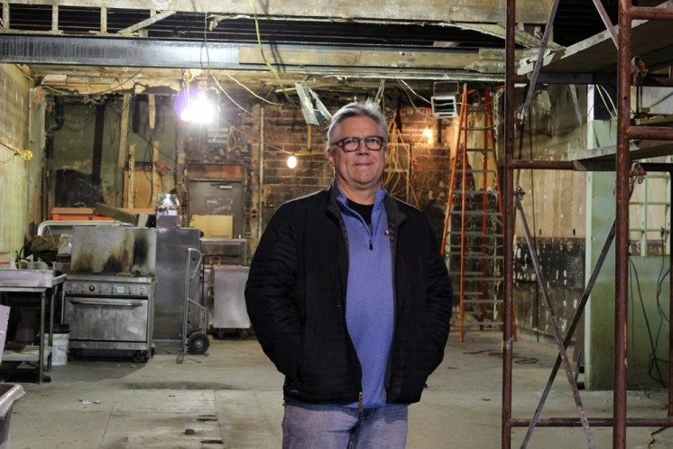 Duluth Grill owner Tom Hanson stands in the gutted 1886 structure that will house his next restaurant venture.