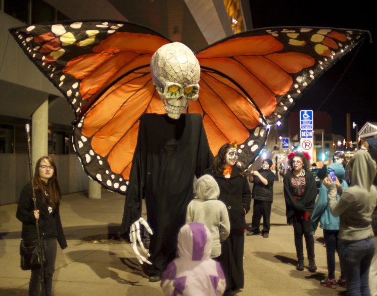 Photo by Steve Ash Foreground 10’ Death papier-mâché and cloth puppet made for the first 2008 Duluth All Souls Night (DASN) with background giant Monarch butterfly made for the 2015 Duluth Children’s Museum as an ARAC art project grant.