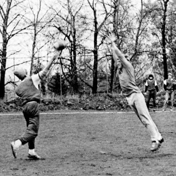 During a wild football game, Kelly Fliear throws a pass to Peter Eaton