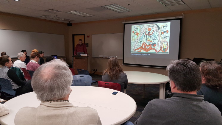 Local artist and design teacher Darren Houser presents on his work, among other presentations at the Martin Library at UMD, organized by Pat Maus.