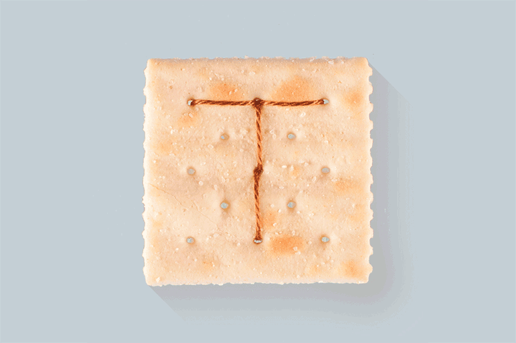 In November 2015, I decided to cross-stitch the alphabet into saltine crackers. This is that.
