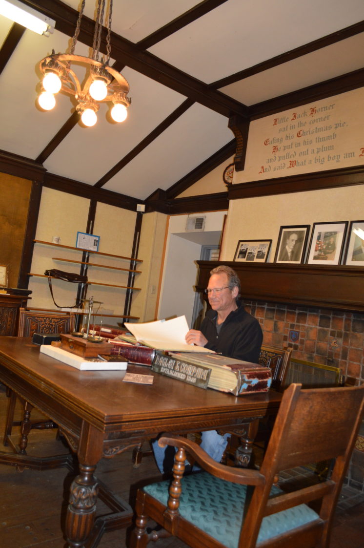 Fourth generation Bagley and Company Jewlers owner Rick Heimbach looks over old records in his former office, a historic tea room. The room will be reopened to the public as a social space when building renovations are complete.