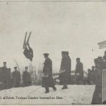 John Rudd turning a complete somersault on skis