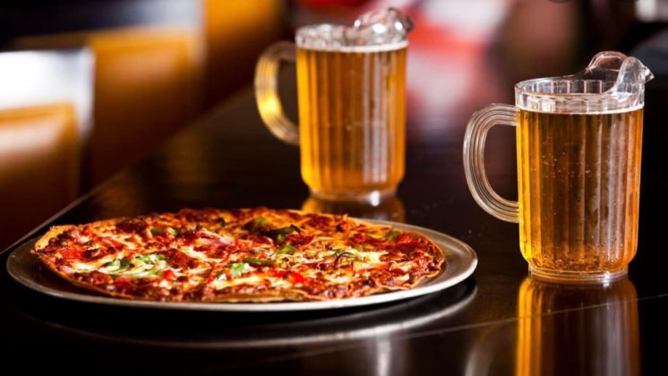 Ride or Die pizza with two pitchers of beer