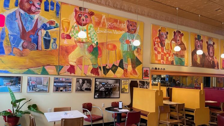 Colorful paintings of the Arrowhead with bears wearing clothing