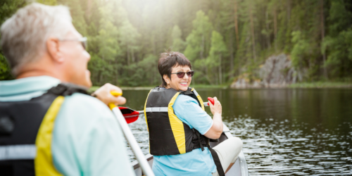 Canoeing Couple in Life Vests