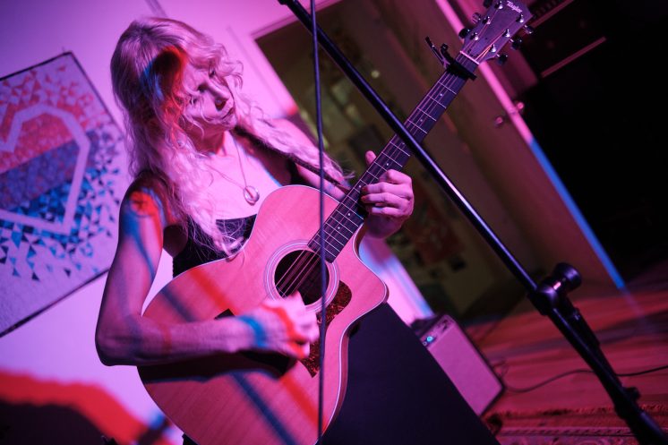 Mara Lovejoy playing guitar at Prøve Gallery, Sept. 12, 2026